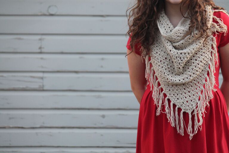 Young lady in red dress modeling the Amarillo crochet cowl.